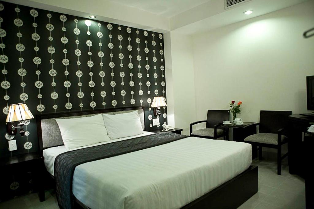Hoang Vinh Hotel Хошимин Стая снимка
